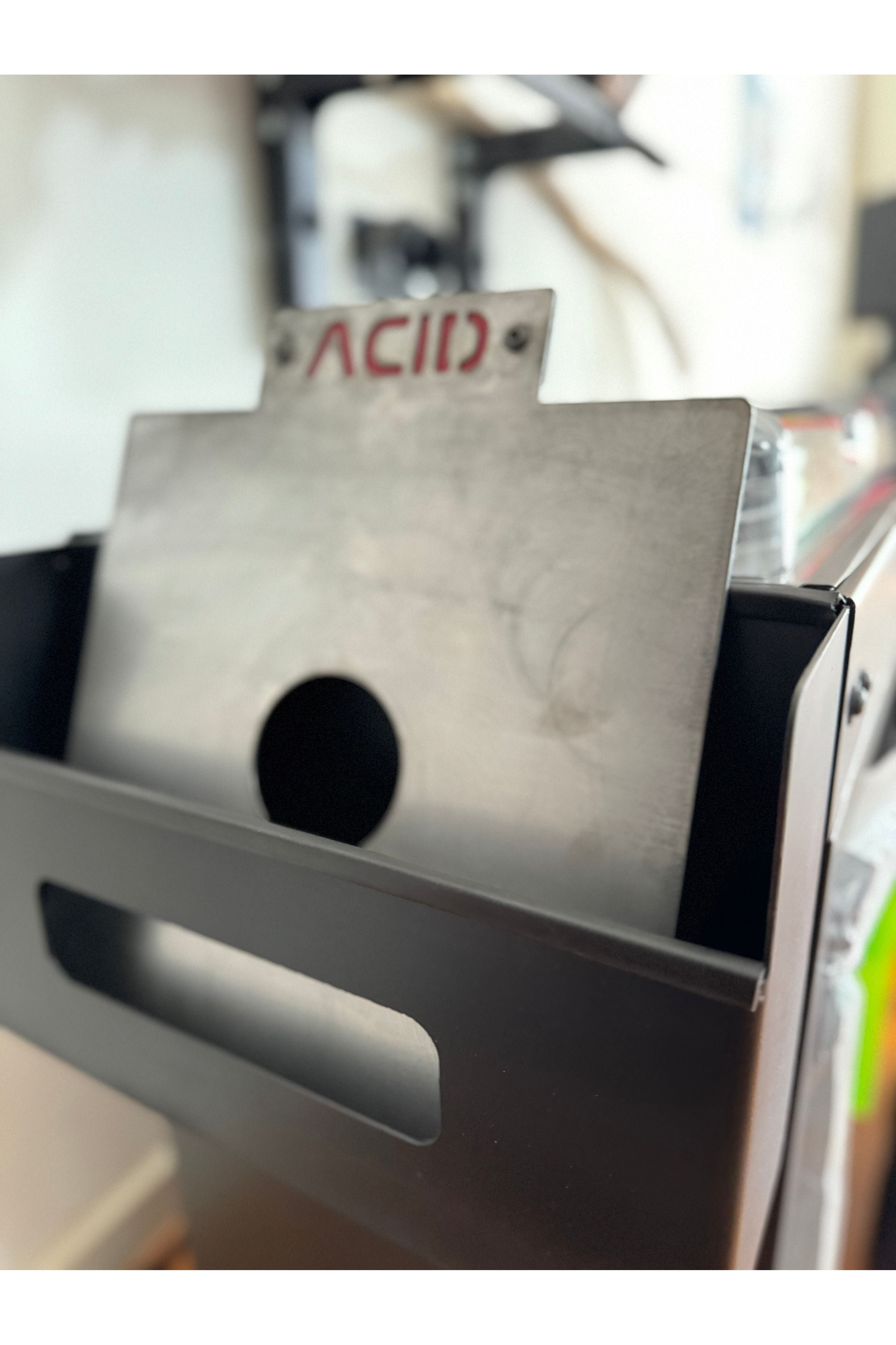 Raw Steel Divider with Red Background in a Citadel Console Topper Bin